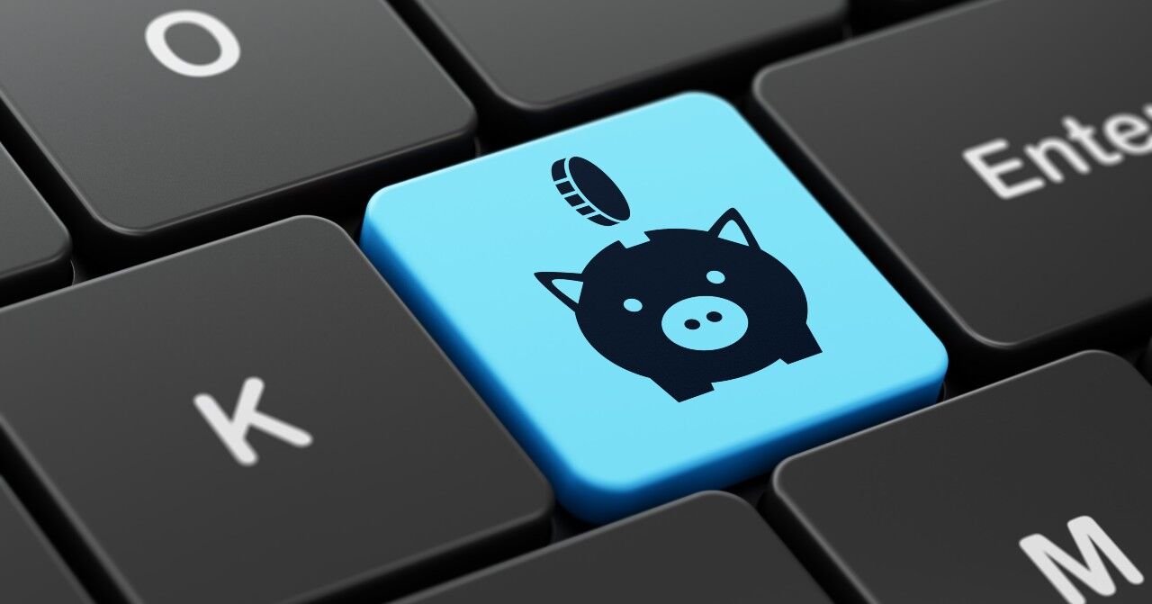 Tecla de teclado com porquinho e moeda